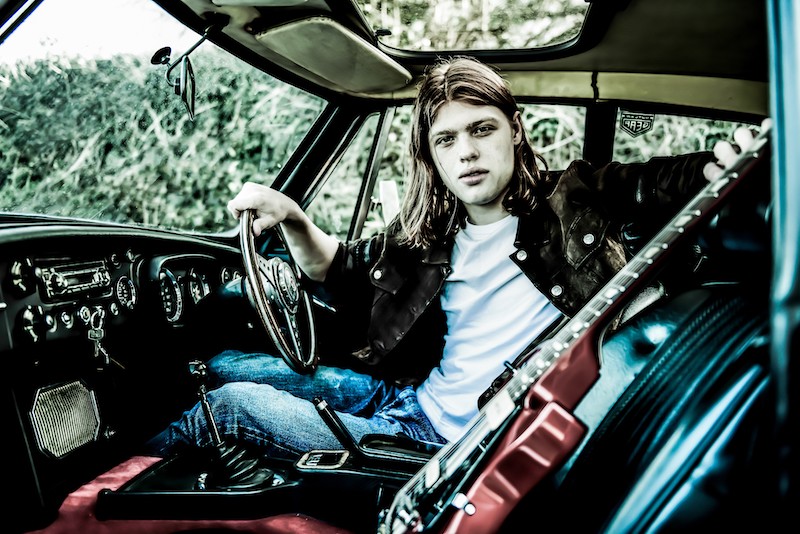 Toby Lee and his Firebird guitar in his Volkswagen 
