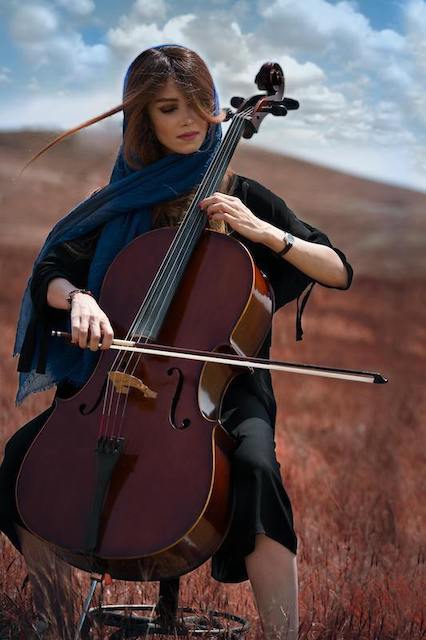 woman playing viola during travels