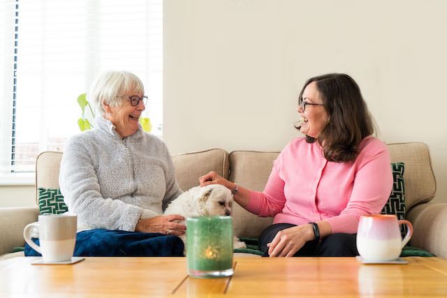 grandmother with daughter and dog