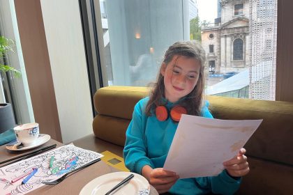 girl reading restaurant menu