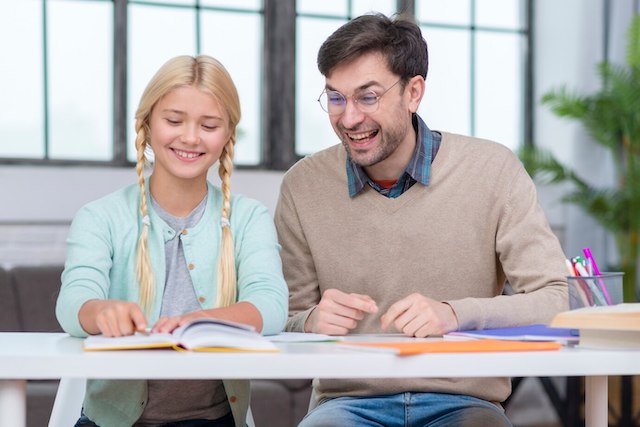 teacher young student having good time