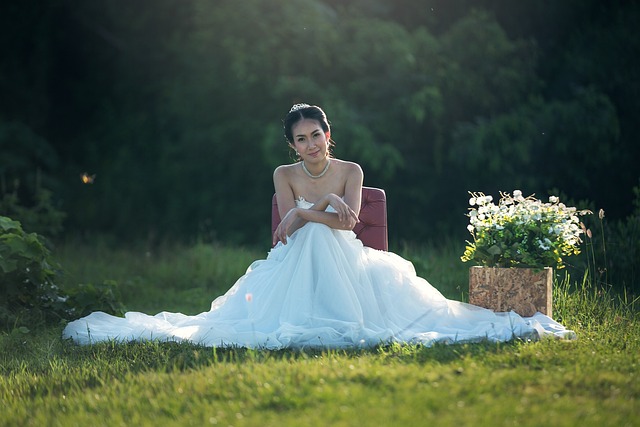 bride sitting on grass