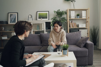 teens talking on the couch