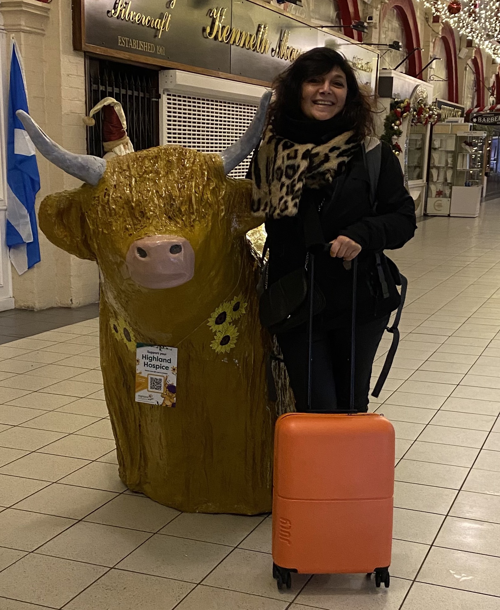 woman with orange trolley posing for mums magazine