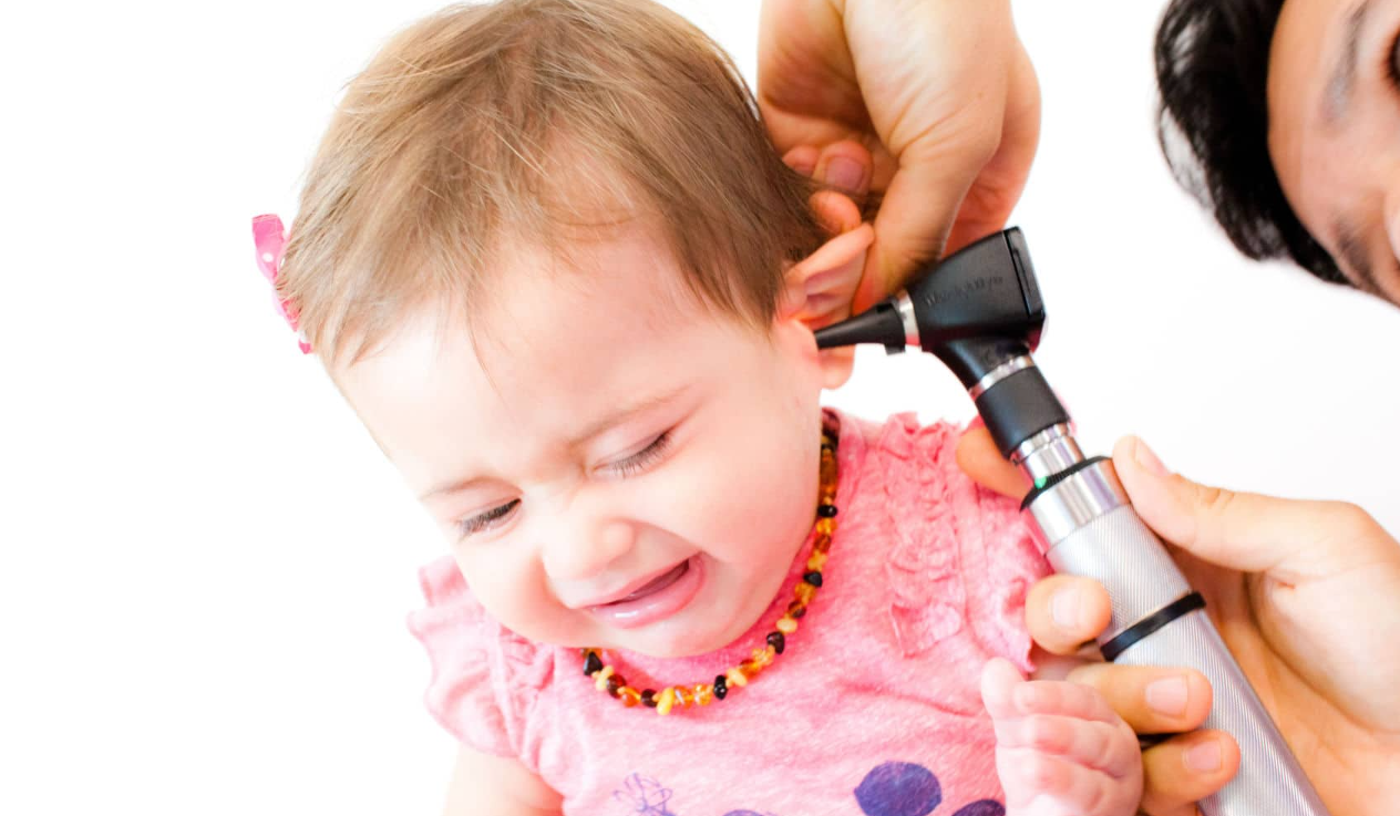 baby getting an ear examination