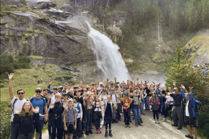 Online students at SBL gather under stunning waterfall