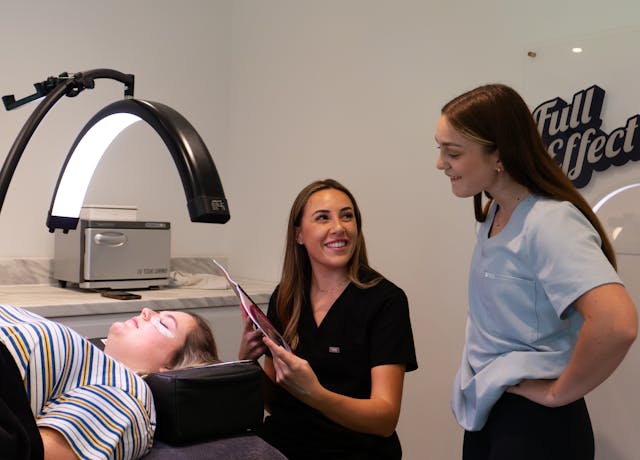 Dermatologist consulting with a patient in a modern clinic for skin health assessment.