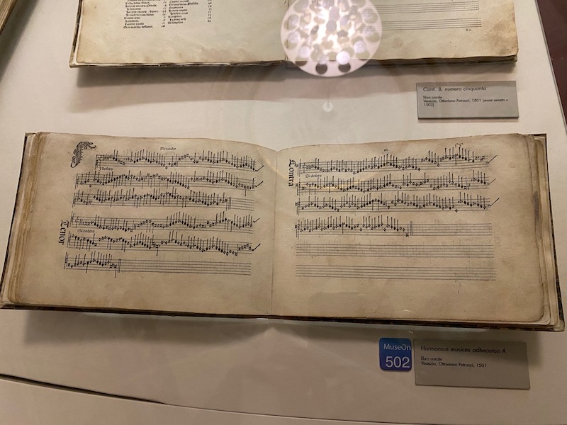 The most precious book by Petrucci (1501): the first book in the world ever printed with musical notation — a work of immeasurable cultural value.