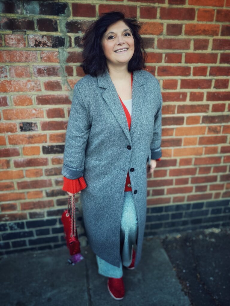 Monica Costa posing for mums magazine in fashion coat by American vintage 