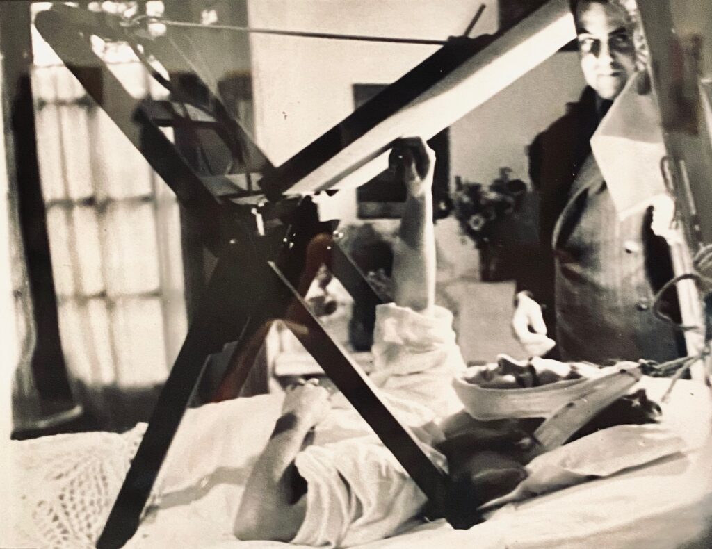 Frida Kahlo black and white photo painting in bed