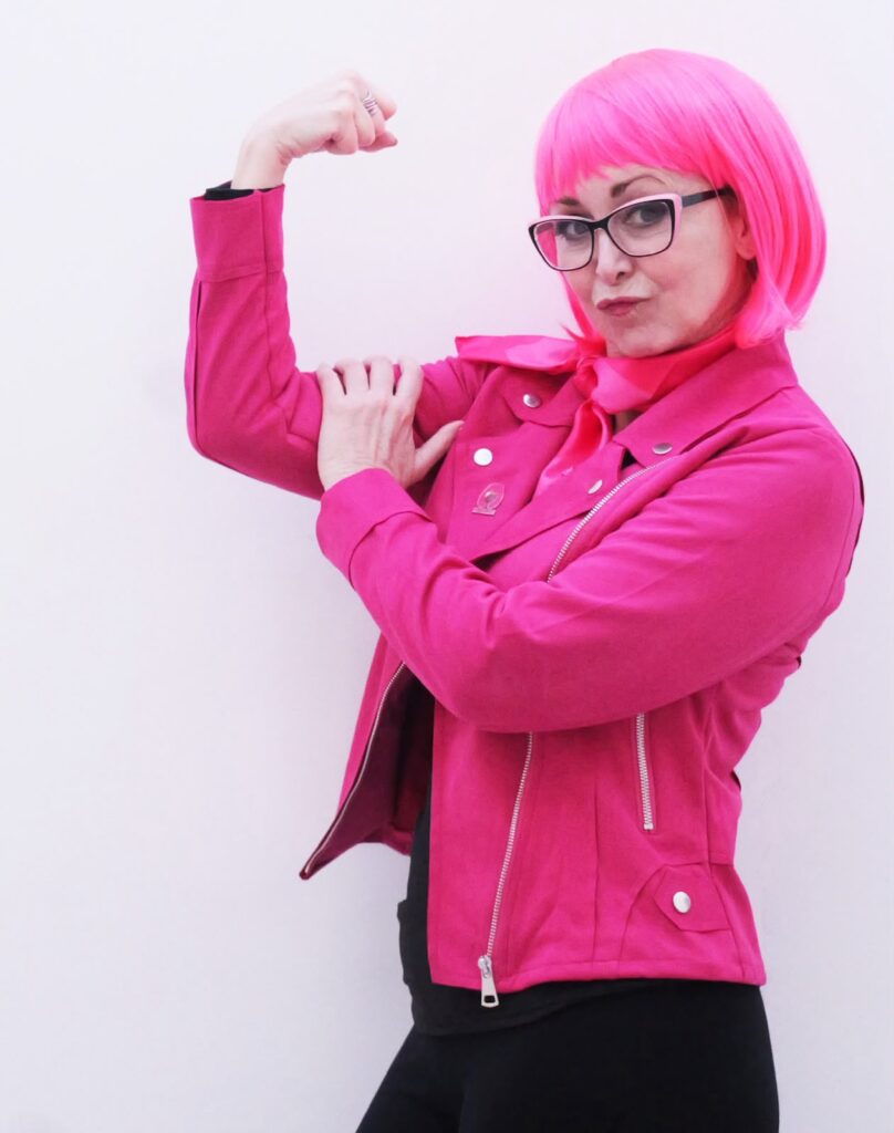 Federica wearing a bright pink bob wig, the symbol of The Pink Bob breast cancer awareness initiative.