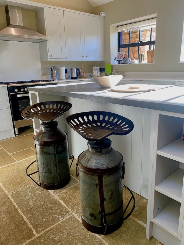 seats made from upcycled milk churns topped with tractor seats